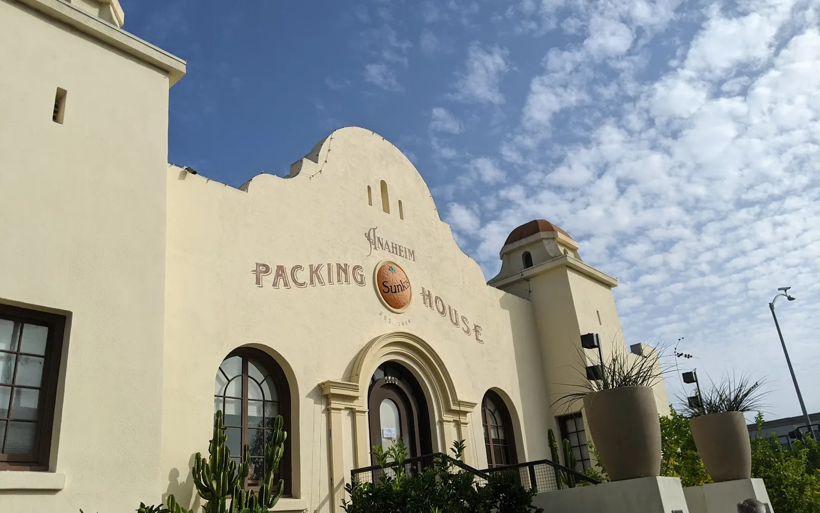 Facade of the historic Anaheim Packing House on a sunny day